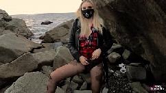 Teen girl in a plaid skirt masturbates pussy to public outdoors near the sea real female orgasm