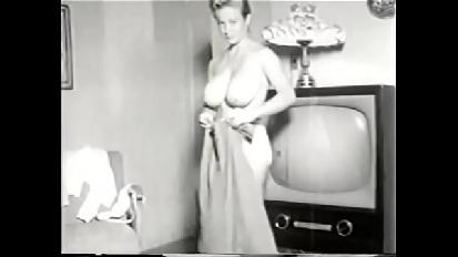 Vintage busty beauty bends over bends over tv showing her big tight breasts for you